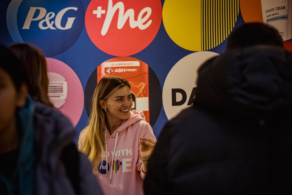 P&G exhibitor stand, with a young woman with blond hair in the background